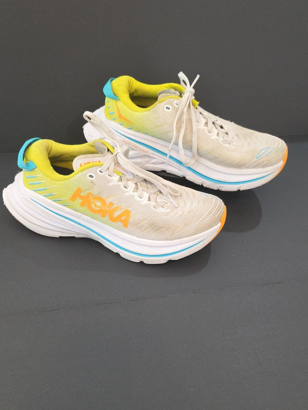 Hoka Bondi X Neutral Running Shoes in Beige with Yellow, Blue & Orange Size 7B